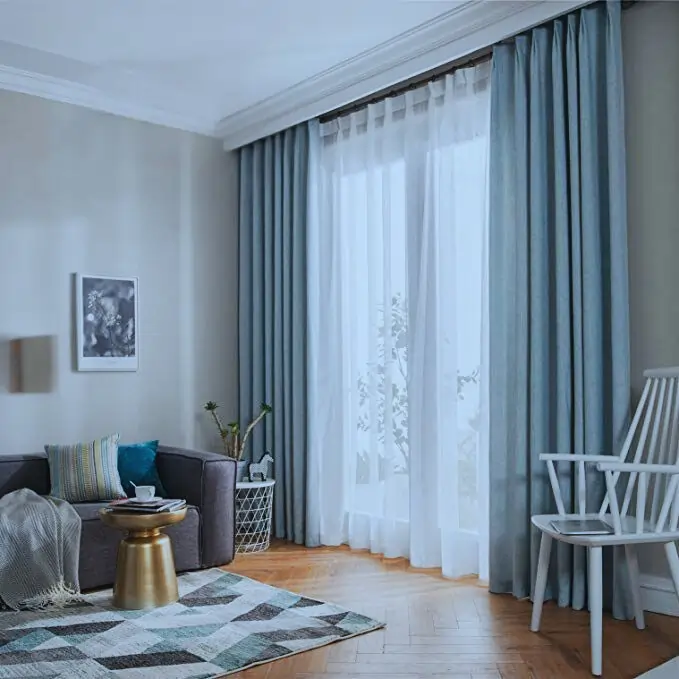 light blue linen curtain in dubai near a sliding window
